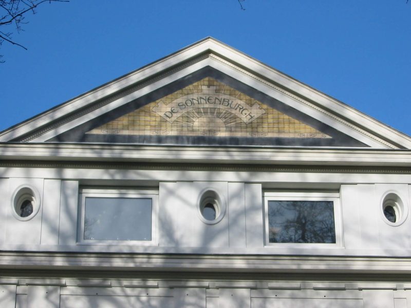 The characteristic pediment detail of the building